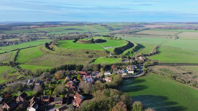 Aerial shot flying towards the ancient fort of Old Sarum, Salisbury, Wiltshire