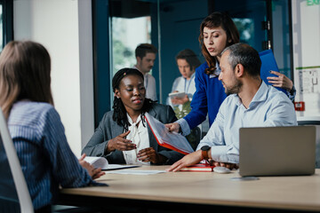 Black Female Manager Leading Feedback Session as Student Intern Joins Team
