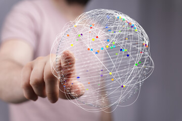 Abstract image showing a hand interacting with a digital globe, symbolizing global network, communication and connectivity.