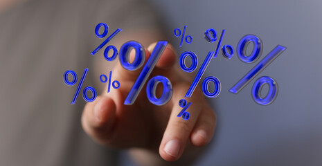 A close-up of a person's finger interacting with a group of 3D-rendered percentage symbols,...