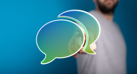 Concept image of a man holding a message bubble, representing communication, social media, and digital interaction. Ideal for blogs, websites, a
