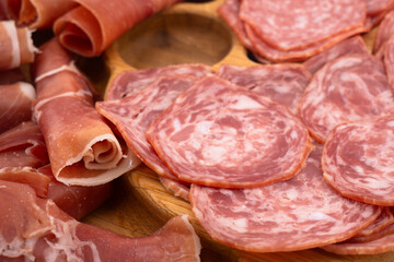 Cured meat platter. Italian meat platter prosciutto ham, bresaola, pancetta, salami.