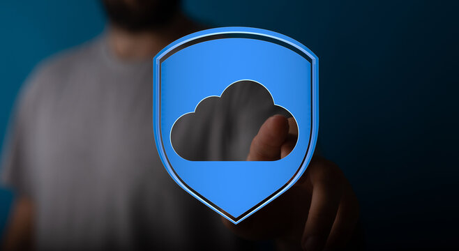 Hand pressing a cloud data protection shield. Secure cloud computing, data privacy and online safety concept