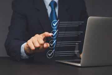 Businessman touching digital checklist interface.