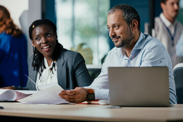Smiling Black Woman Leading Feedback Session Meeting in Modern Open Office