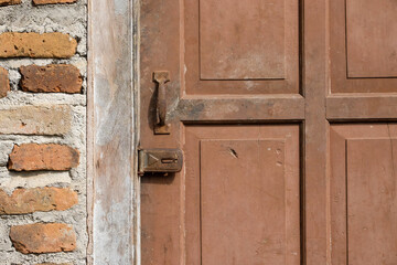 Old wooden door with rusty handle and lock. For graphic design, 3D rendering and banners