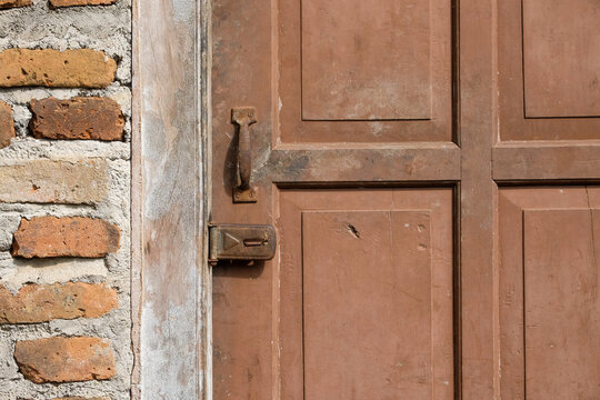 Old wooden door with rusty handle and lock. For graphic design, 3D rendering and banners