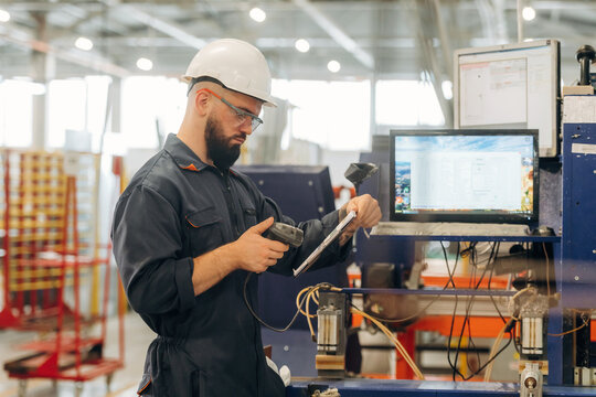 Production conception, quality control. Warehouse worker in an industrial environment of a factory or storage area