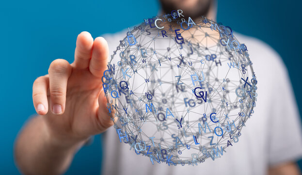 A person's hand interacting with a digital sphere of letters representing data, technology, and global connecti - Powered by Adobe