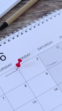 2026 January first, new year day calendar date on wooden table. Vertical video. Business planning, goals, and resolutions concept.
