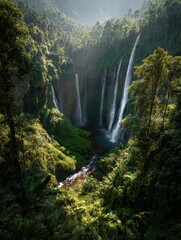 Majestic Tumpak Sewu Waterfall - Cascading Waters Through Lush Greenery, Indonesia.