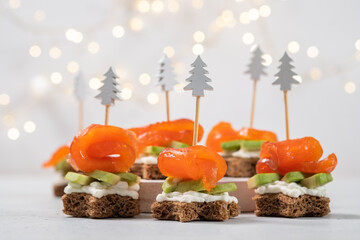 Colorful appetizer bites with smoked salmon and avocado for a festive occasion