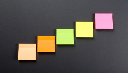 Marketing plan brainstorming sticky strategy business idea creativity note planning teamwork colorful sticky notes ascending order dark background