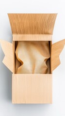 Top-down view of an open cardboard box with tissue paper inside, set against a white background.