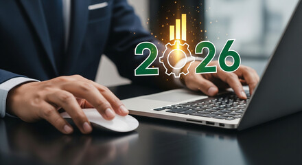 Executive analyzing business growth and technology strategy in 2026 using a laptop, showing a financial chart and mechanical gear overlay for innovation and success planning