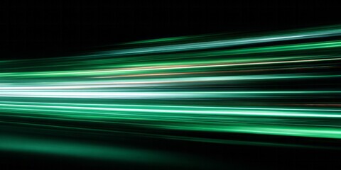 Intense green light streaks create an abstract depiction of rapid motion across a dark background.