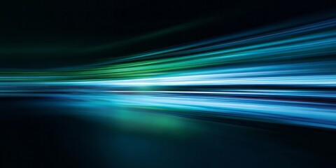 Intense motion blur streaks across a dark background with vibrant blue and green light trails