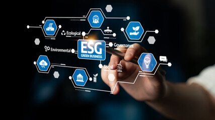 A hand interacts with a digital display showcasing the ESG framework, emphasizing the importance of sustainable business practices in today corporate landscape. Tessel