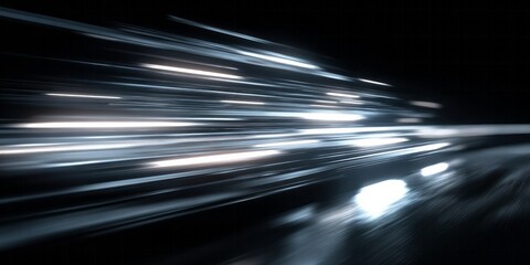 Streaks of bright white and pale blue light move rapidly across a dark background suggesting high speed motion