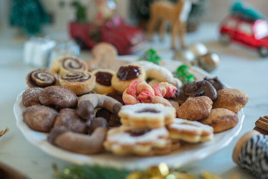 Christmas cookies baking on wooden background - Powered by Adobe