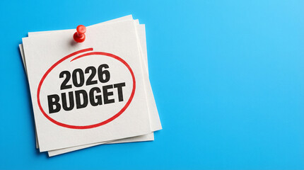 2026 budget planning reminder on pinned note card, financial forecast and annual business finance concept.