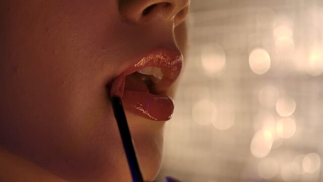 Close up of Lips with Shiny Lip Gloss Application