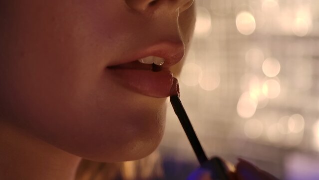 Close up of Lips with Shiny Lip Gloss Application