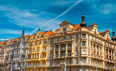 Ornate facades of historic baroque architecture against blue sky.