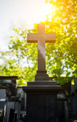 Memorial stone cross in the forest cemetery.