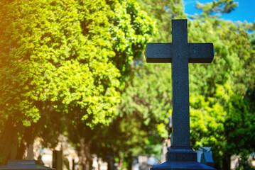 Memorial stone cross in the forest cemetery.