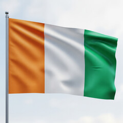 Obraz premium The flag of Ivory Coast waving in the wind against a cloudy sky background.