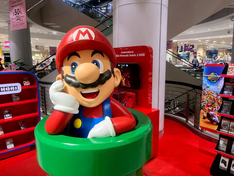 Super Mario Bros model figure dolls characters from Super Mario Bros game from Nintendo decorated display in Nintendo authorized shop in Paragon mall with background of many Nintendo Switch games