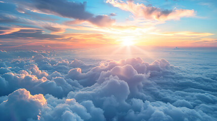 a view of the sun rising over the clouds