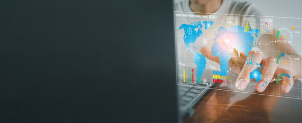 Businessman touching virtual global map interface with data analytics charts, representing future technology, digital network connection, fintech strategy, and world economy concept.