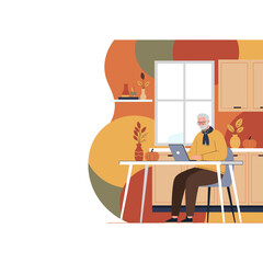 Senior man working on laptop at home in a cozy autumnal kitchen Digital connection and remote lifestyle
