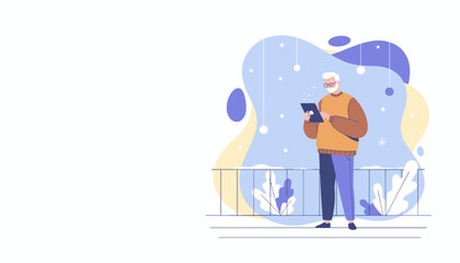 Senior man using digital tablet on balcony during winter digital communication and modern retirement