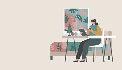 Cozy remote work Woman using smartphone and tablet near holiday decorations