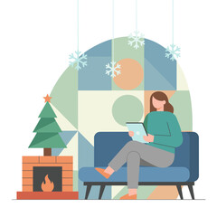 Woman reading tablet by the fireplace Relaxing winter holiday scene with Christmas tree