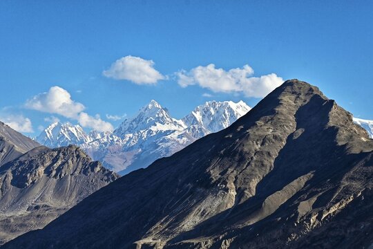 Nanga Parbat, Rakaposhi, and Haramosh are prominent, high-altitude mountains located in the Gilgit-Baltistan region of Pakistan. Nanga Parbat is part of the Himalayas, while Rakaposhi and Haramosh are