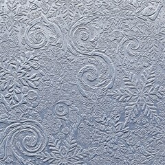 Silver winter texture featuring embossed snowflakes and swirling decorative patterns