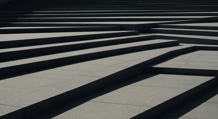 Abstract design of layered, angled paving stones.  Shadows create patterns