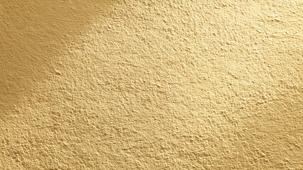 Close-up of a warm golden-beige textured wall, likely stucco or plaster, with distinct granular patterns and subtle lighting. Excellent background.