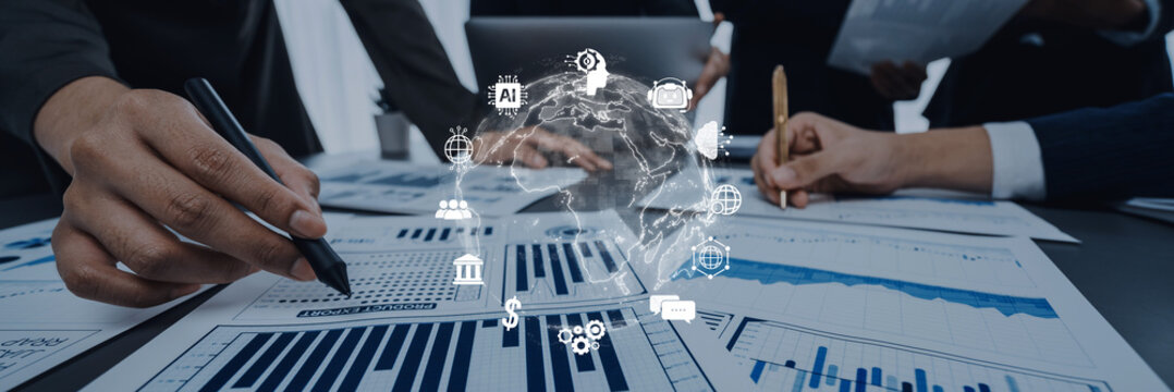 Business professionals engage in data analysis with graphs and charts. The image captures teamwork, technology, and insights in a modern office environment. Trope