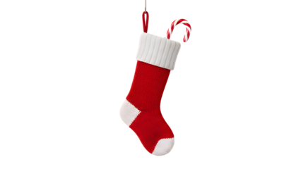 Festive red christmas stocking with a candy cane hanging against on transparent background
