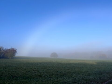 White rainbow in the morning mist