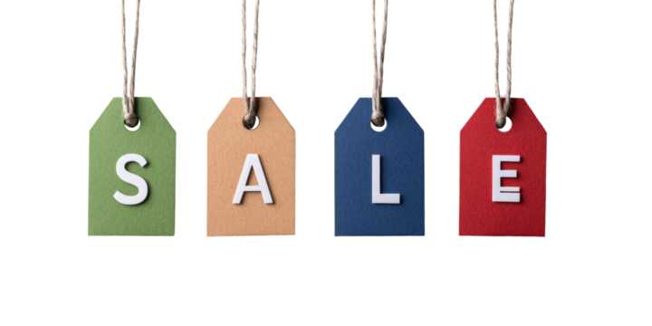 Colorful sale tags hanging against black background