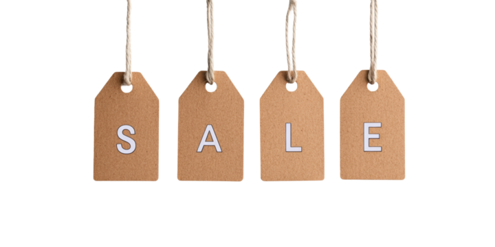 Hanging sale tags with letters on brown paper against black background - Powered by Adobe