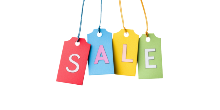 Colorful sale tags hanging against black background