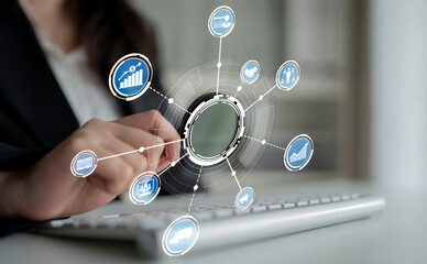 A professional woman interacts with a laptop, surrounded by digital icons that symbolize data analysis and connectivity in a modern business environment. Crux