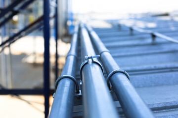 Good manage network electric cable with metal flex pipe. Isolated on white background. Installation of electrical wiring on wall. Electrical cable system installation.